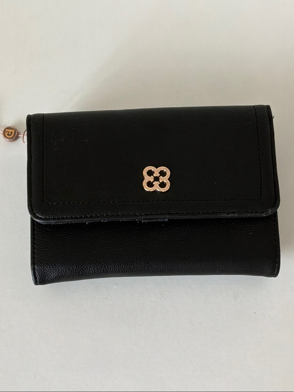 Black wallet with straps to turn into crossbody bag